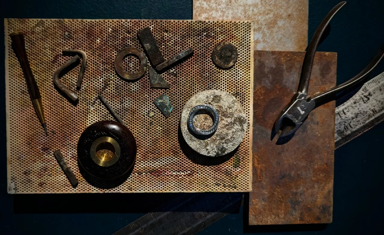Diamond and Platinum Rings with Rustic Jewellery Workshop Tools
