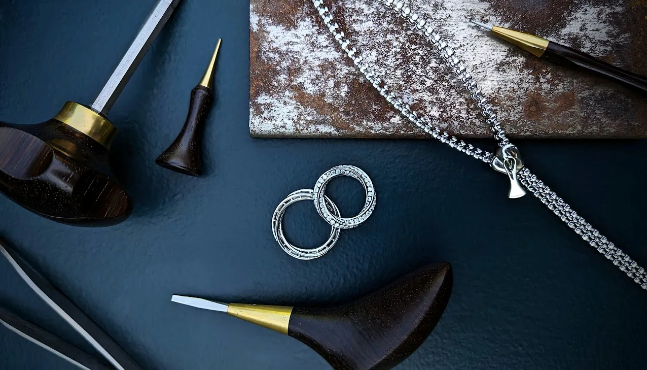 Diamond and Platinum Rings and Necklace with Rustic Jewellery Workshop Tools
